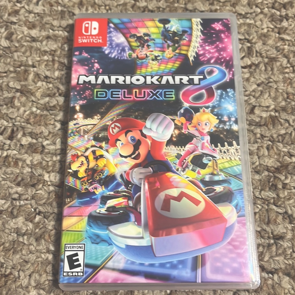 3 Used Nintendo switch games which is Mariokart delux, Arms, and Legend of Zelda